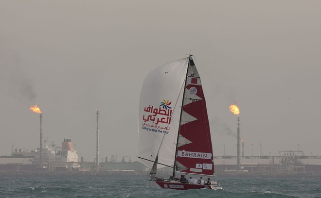 Team Kingdom of Saudi Arabia with oil fields in background - Sailing Arabia - The Tour 2012 © Lloyd Images http://lloydimagesgallery.photoshelter.com/